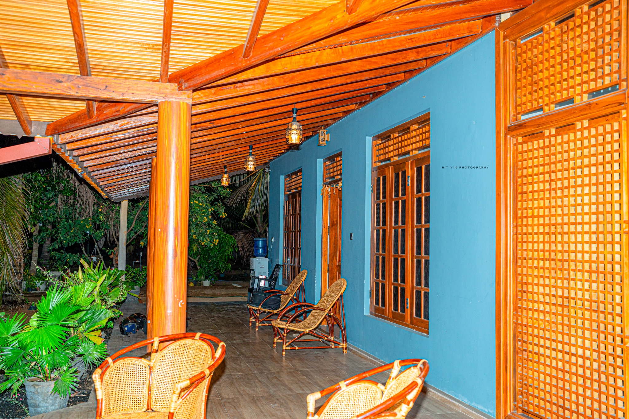 Covered veranda and tropical plants at Kal Pasi Resort